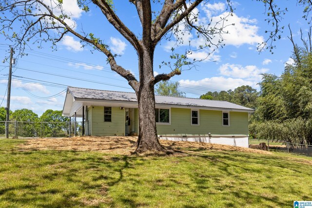 7096 US Highway 231, Cropwell, AL 35054 - rear view of property featuring a lawn and fence