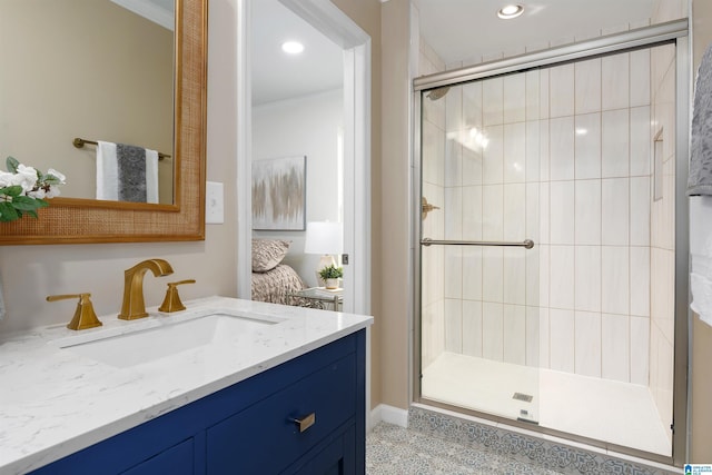 full bath with ornamental molding, recessed lighting, a shower stall, and vanity