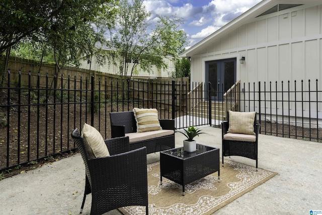 view of patio with french doors, an outdoor hangout area, and a fenced backyard