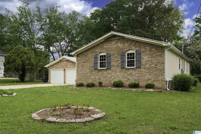 ranch-style home featuring brick siding, a front yard, driveway, and an attached garage