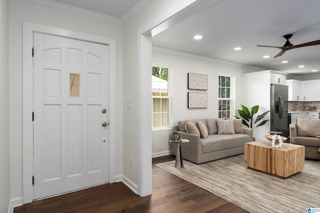 living area featuring ceiling fan, baseboards, recessed lighting, ornamental molding, and dark wood-type flooring