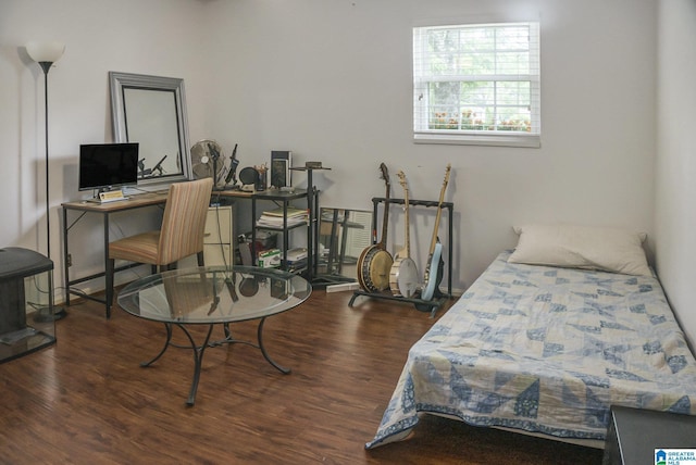 bedroom featuring wood finished floors