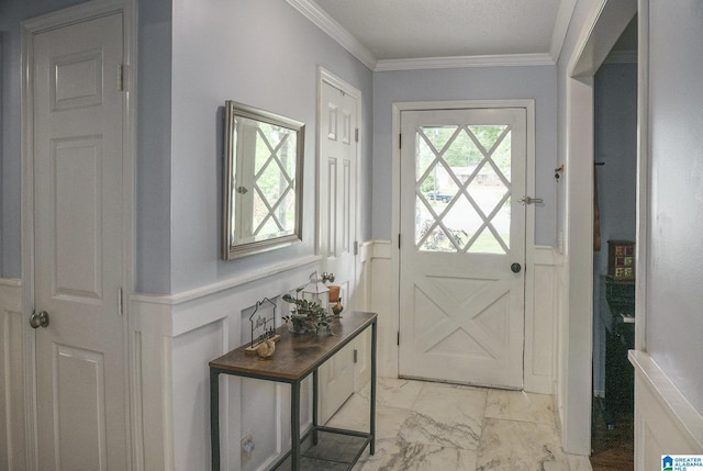 doorway with crown molding, a wainscoted wall, marble finish floor, and a decorative wall