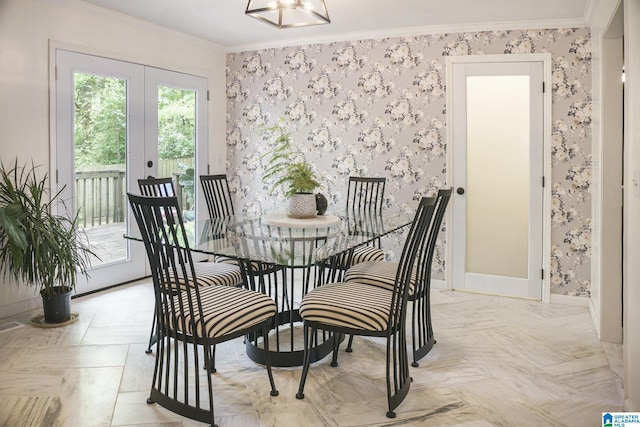 dining area featuring wallpapered walls, baseboards, ornamental molding, and french doors