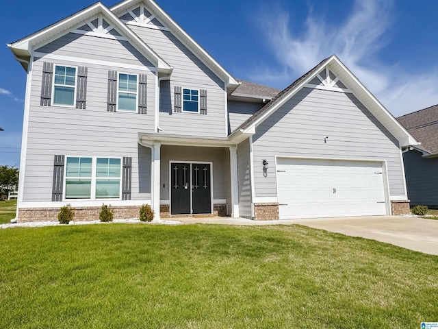 craftsman-style house with brick siding, driveway, a front yard, and a garage