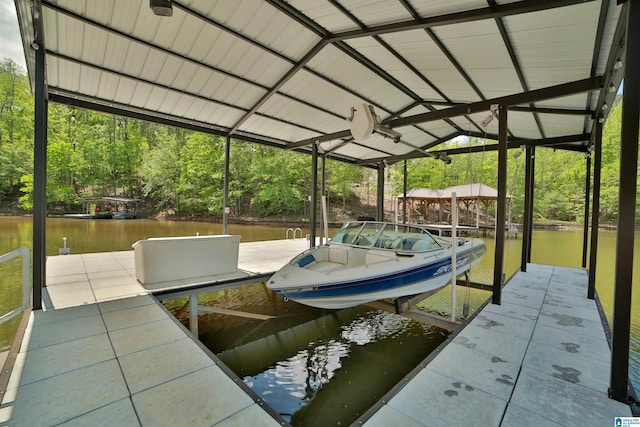 view of dock with boat lift and a water view