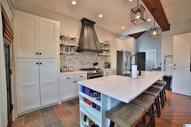 kitchen featuring open shelves, appliances with stainless steel finishes, backsplash, and island exhaust hood