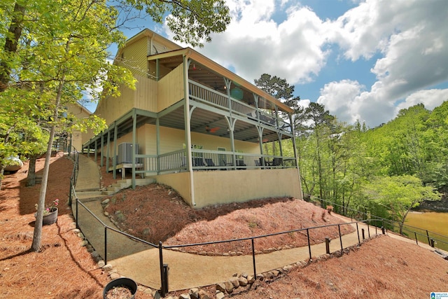 view of side of home featuring fence