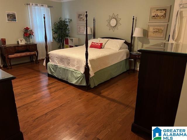 bedroom featuring wood finished floors