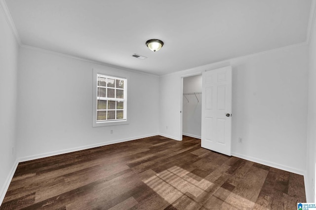 300 6th St, Docena, AL 35060 - unfurnished bedroom featuring ornamental molding, dark wood-style floors, visible vents, and baseboards