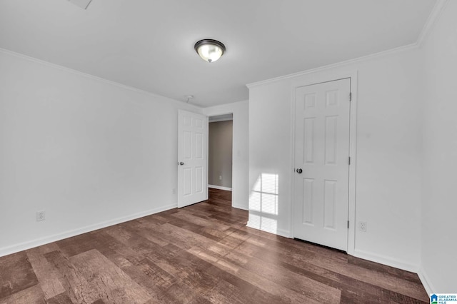 300 6th St, Docena, AL 35060 - unfurnished bedroom featuring baseboards, wood finished floors, and ornamental molding