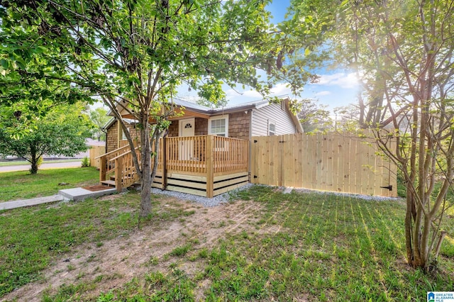 300 6th St, Docena, AL 35060 - view of front facade with fence and a front lawn