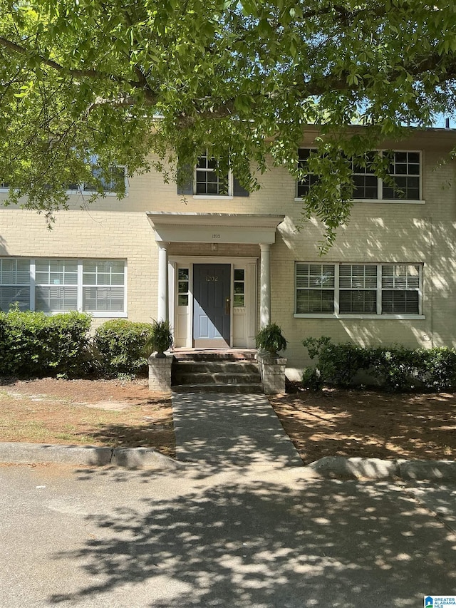 view of front of property featuring brick siding
