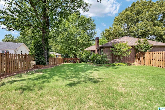 view of yard featuring a fenced backyard
