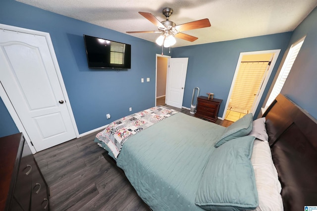 bedroom featuring ceiling fan, baseboards, and dark wood-type flooring