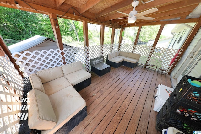 deck with an outdoor hangout area and ceiling fan