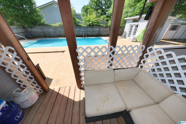 view of pool featuring a fenced backyard, a fenced in pool, and french doors