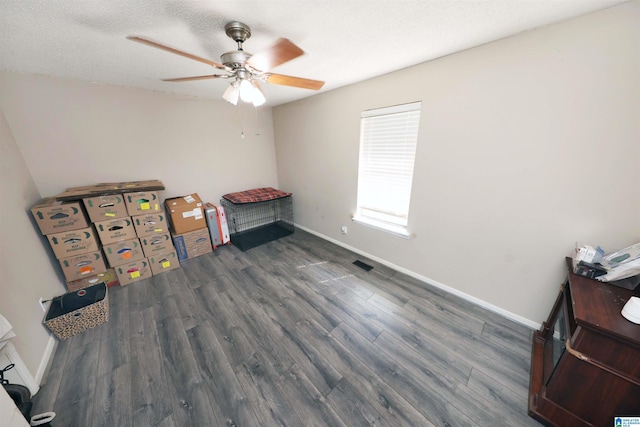 bedroom featuring baseboards, wood finished floors, and visible vents