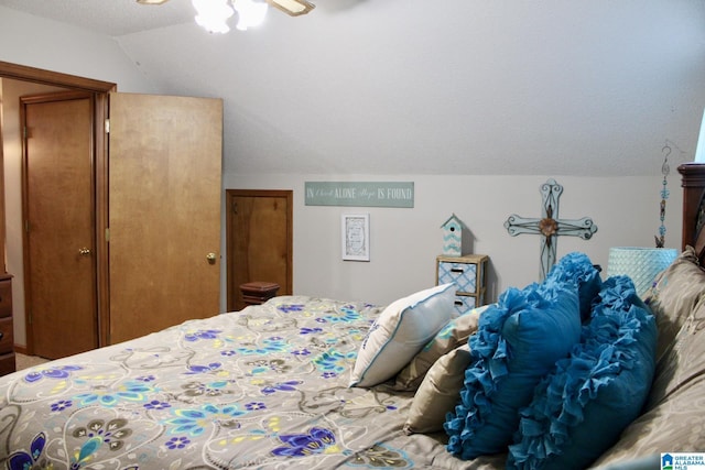 bedroom with a ceiling fan and vaulted ceiling