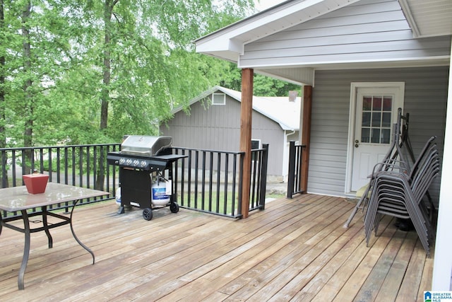 wooden deck with grilling area