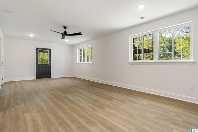 1515 Spring St, Alexander City, AL 35010 - empty room with visible vents, light wood finished floors, baseboards, and ceiling fan