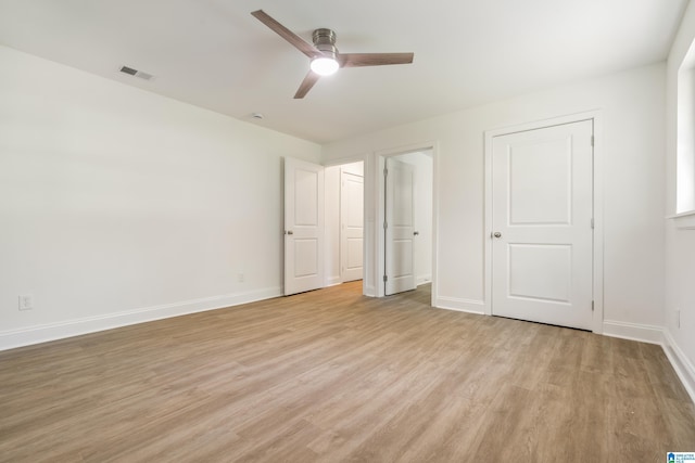 1515 Spring St, Alexander City, AL 35010 - unfurnished bedroom with light wood-type flooring, visible vents, a ceiling fan, and baseboards