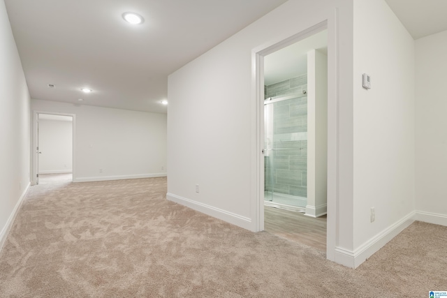 1515 Spring St, Alexander City, AL 35010 - spare room featuring baseboards and light colored carpet