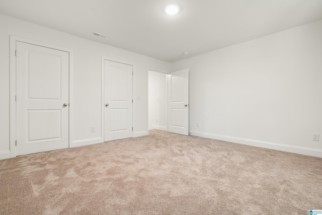 1515 Spring St, Alexander City, AL 35010 - unfurnished bedroom with baseboards, visible vents, and carpet