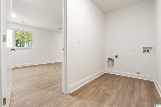 1515 Spring St, Alexander City, AL 35010 - laundry room with hookup for a washing machine, electric dryer hookup, light wood-style floors, baseboards, and visible vents