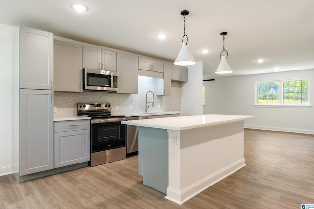 1515 Spring St, Alexander City, AL 35010 - kitchen featuring light countertops, a sink, appliances with stainless steel finishes, and gray cabinets