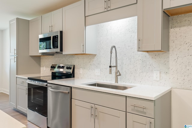 1515 Spring St, Alexander City, AL 35010 - kitchen with stainless steel appliances, light countertops, and a sink