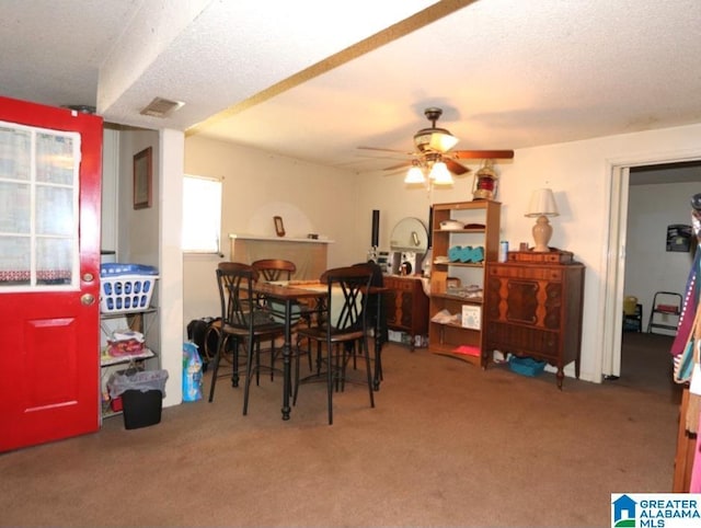 801 Walnut St, Talladega, AL 35160 - dining space featuring a ceiling fan, visible vents, carpet floors, and a textured ceiling