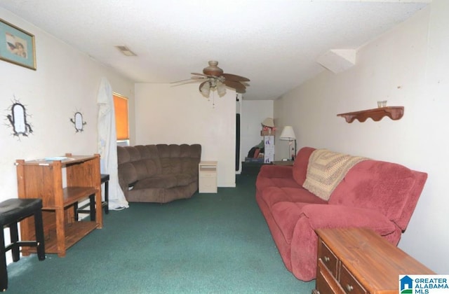801 Walnut St, Talladega, AL 35160 - living room with visible vents, carpet floors, and ceiling fan