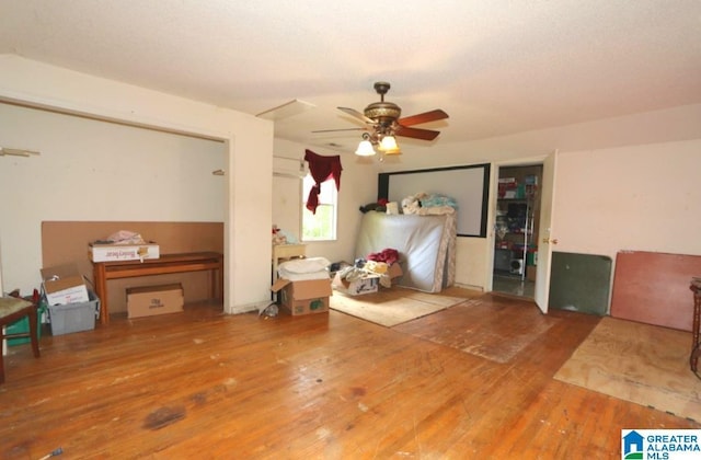 801 Walnut St, Talladega, AL 35160 - bedroom featuring ceiling fan and wood-type flooring