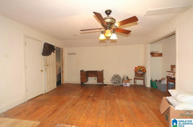 801 Walnut St, Talladega, AL 35160 - living area with a ceiling fan and wood finished floors