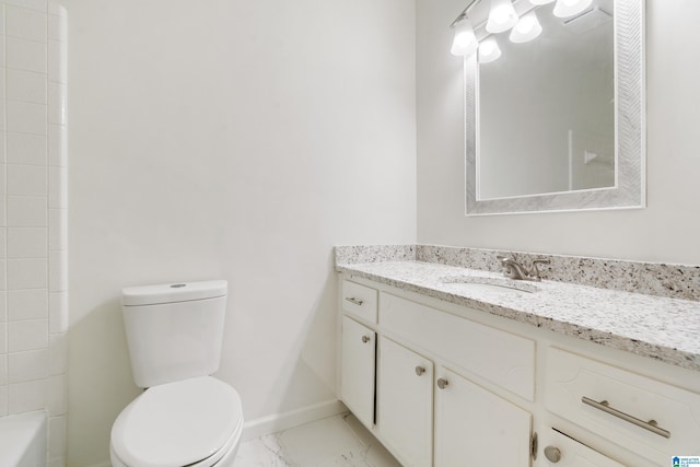 full bath featuring vanity, baseboards, toilet, and marble finish floor