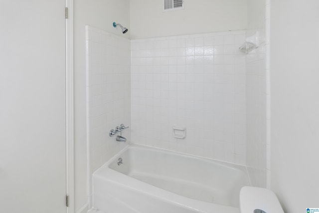 bathroom with visible vents, toilet, and bathing tub / shower combination