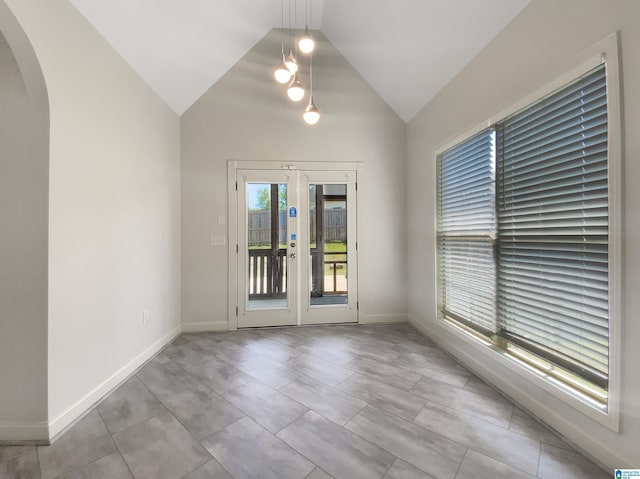131 Willow View Ln, Wilsonville, AL 35186 - unfurnished room featuring arched walkways, lofted ceiling, baseboards, and french doors