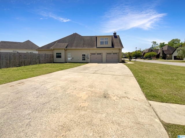 131 Willow View Ln, Wilsonville, AL 35186 - view of front of house featuring a chimney, fence, a shingled roof, concrete driveway, and a front yard