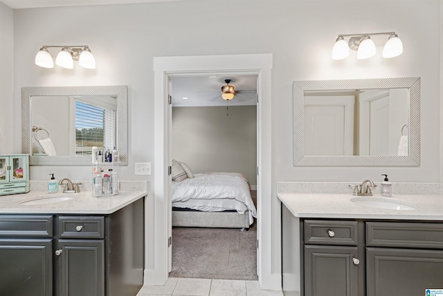 full bathroom featuring two vanities, a sink, and tile patterned floors