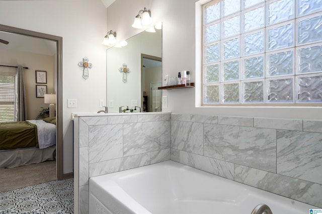 ensuite bathroom with a garden tub and ensuite bath