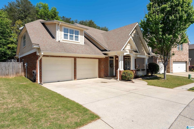 view of front facade featuring driveway, roof with shingles, a front yard, fence, and brick siding