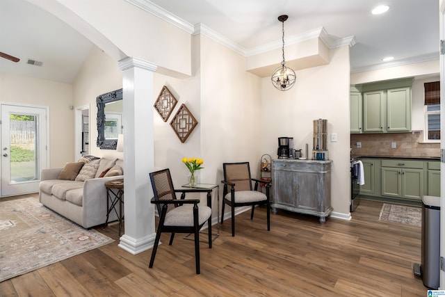 interior space with recessed lighting, dark wood-style flooring, a chandelier, crown molding, and baseboards