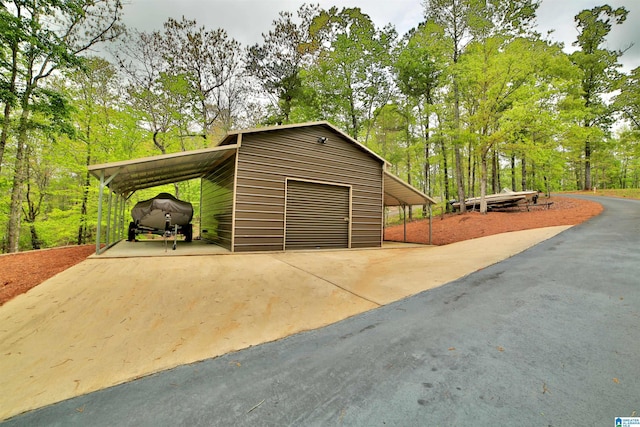 garage featuring aphalt driveway