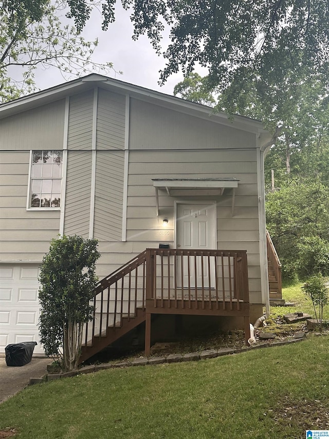 exterior space with an attached garage and a yard