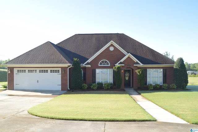 5050 Lily Rd, Hokes Bluff, AL 35903 - ranch-style house with brick siding, an attached garage, a front yard, and driveway
