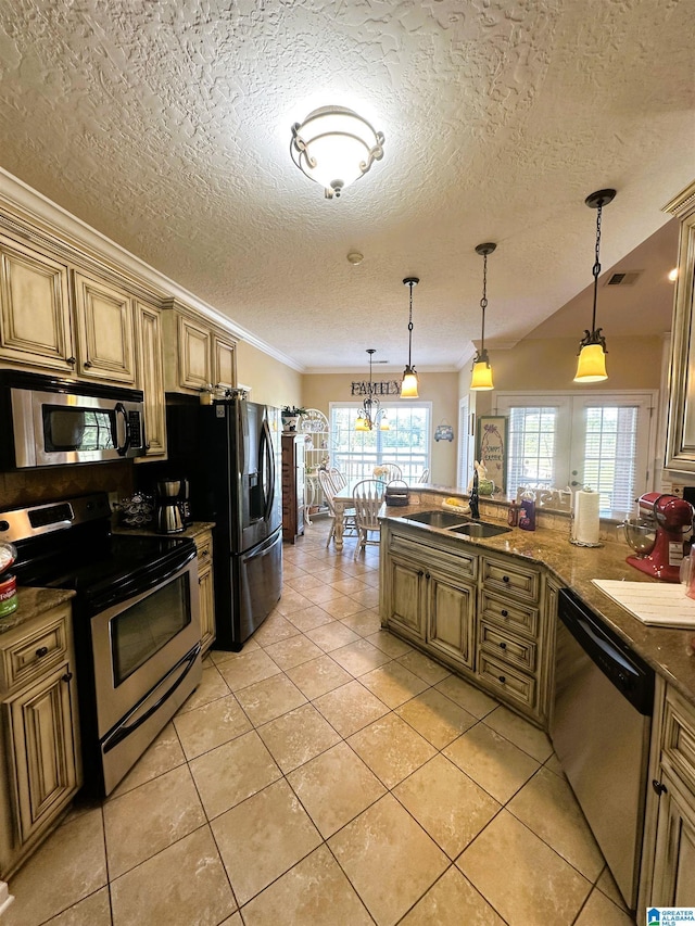 5050 Lily Rd, Hokes Bluff, AL 35903 - kitchen with crown molding, a sink, light tile patterned flooring, a wealth of natural light, and stainless steel appliances
