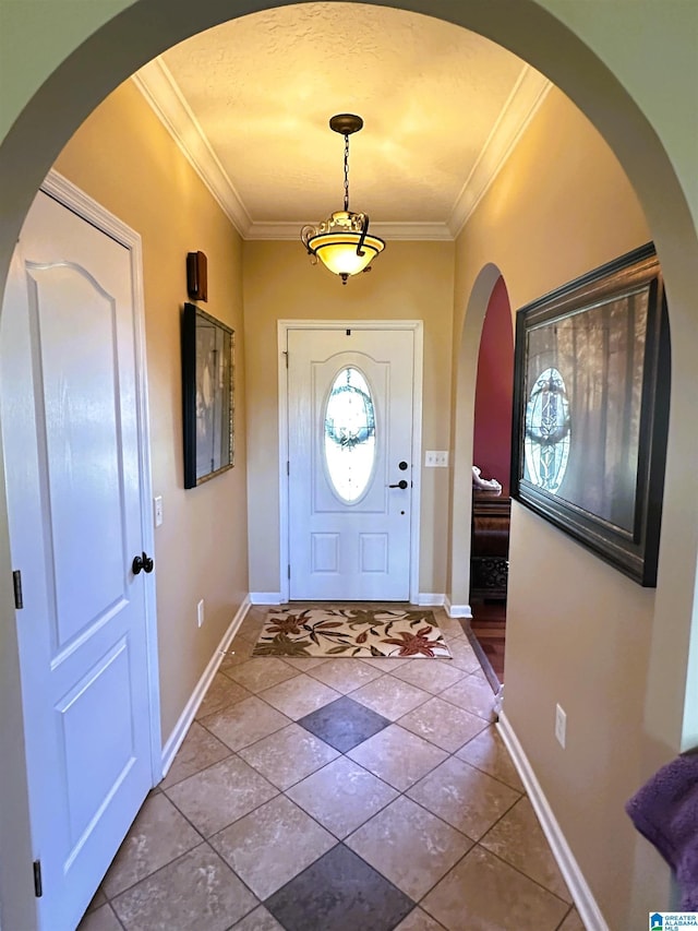 5050 Lily Rd, Hokes Bluff, AL 35903 - foyer with tile patterned flooring, baseboards, arched walkways, and ornamental molding