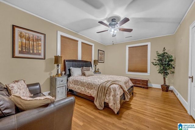 2910 W Meighan Blvd, Gadsden, AL 35904 - bedroom with light wood-type flooring, crown molding, baseboards, and ceiling fan