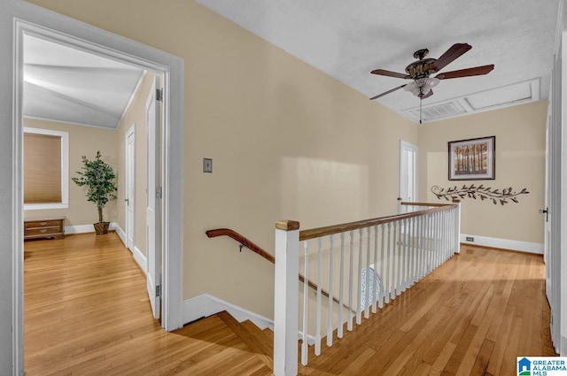 2910 W Meighan Blvd, Gadsden, AL 35904 - hallway featuring baseboards, an upstairs landing, and light wood finished floors